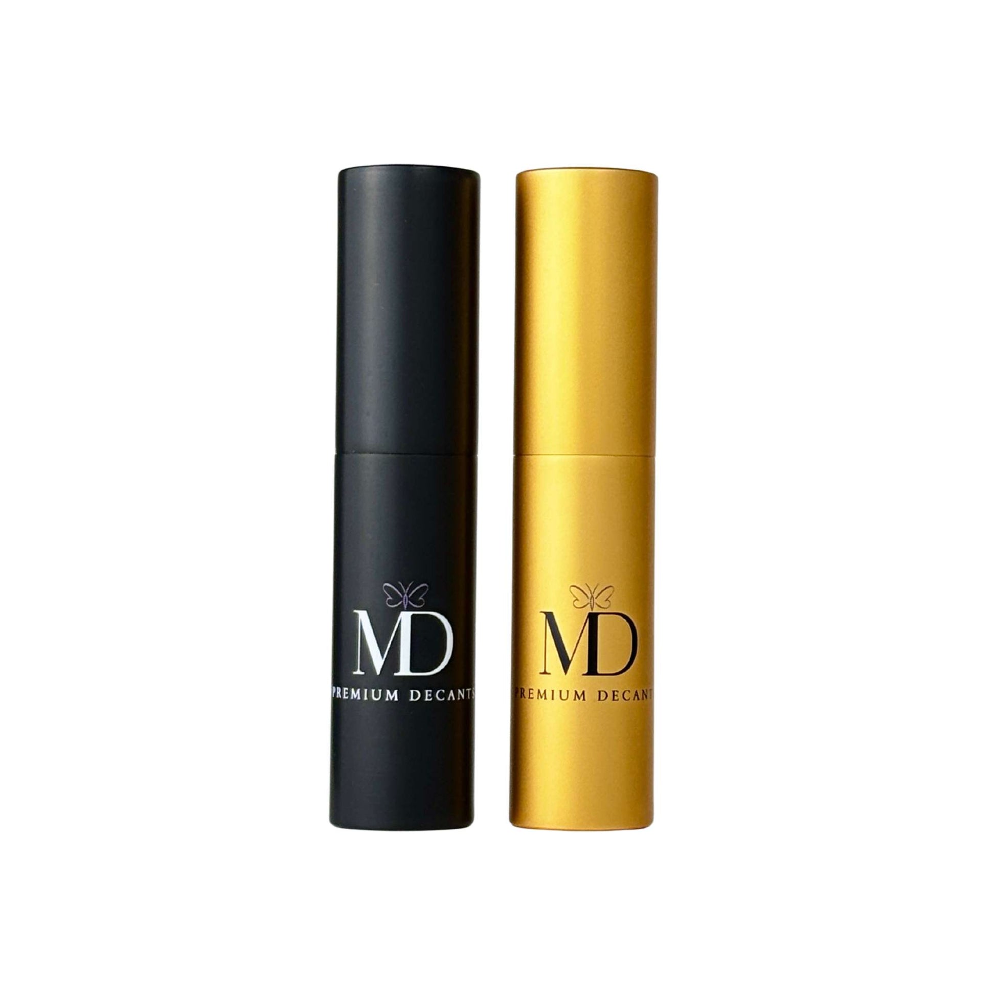 Two premium decant spray bottles from MD Decants, one in matte black and one in metallic gold, standing side-by-side on a plain white background.